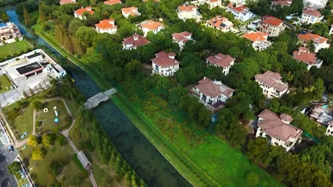 Forward Drone Flight Over Canal and Residential Villas Near Sheshan 動画素材 341367025