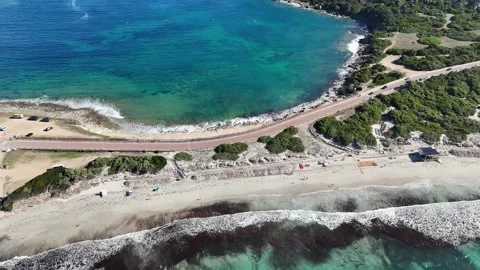 Forward Drone Flight Over Capo Testa Coastal Path with Divided Sea in Sa Stock Footage 332234964