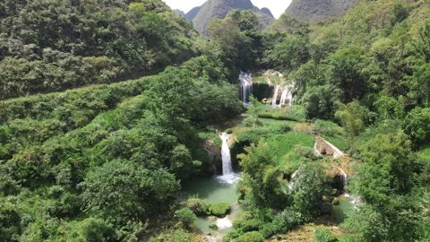 Forward Drone Flight Over Cascading Waterfalls and Emerald Pools Guangxi Stock Footage 330279971