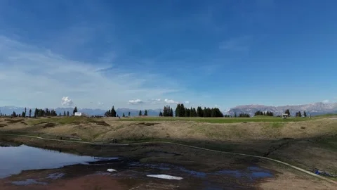 Forward Drone Flight Over Deep Alpine Valley Towards Snowy Mountain Peak Video stock 339128506