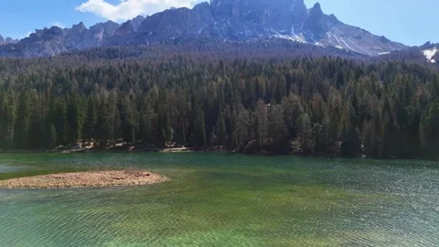 Forward Drone Flight Over Emerald Waters of Lago di Misurina Towards Pin Stock Footage 340121024