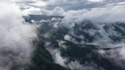 Forward Drone Flight Over Fast Moving Clouds and Mountains, South Korea Stock Footage 345867491