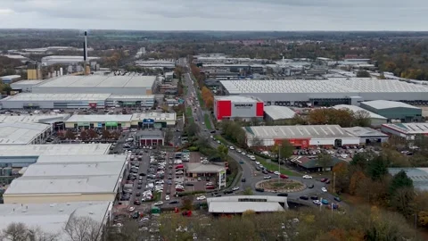 Forward drone flight over Harlow's Temple Mills Retail Park, showing Shurgard Stock Footage 321347145