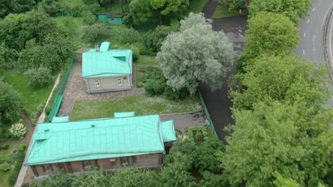 Forward drone flight over historic buildings and park Stock Footage 327620317