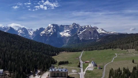 Forward Drone Flight Over Historic Alpine Hotel Towards Jagged Mountain 스톡 동영상 340254141