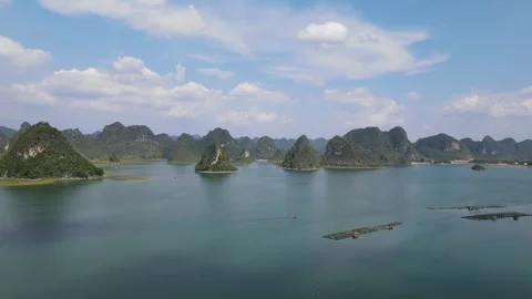 Forward Drone Flight Over Karst Islands and Blue Lake Guangxi China Stock Footage 330281730