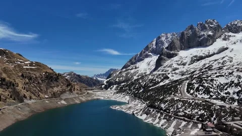 Forward Drone Flight Over Lago di Fedaia Towards Marmolada Massif in Dol Video stock 339661593