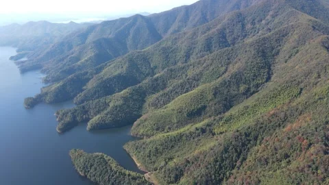 Forward Drone Flight Over Mountain Reservoir and Rolling Hills Anhui China Stock Footage 330457040