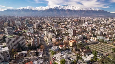 Forward drone flight over Providencia with Andes mountains in background Stock Footage 310795408
