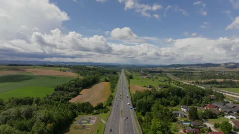 Forward drone flight over six-lane autobahn on sunny day Stock Footage 264074551
