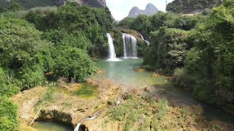 Forward Drone Flight Over Turquoise Waterfall Basin in Karst Forest Guangxi Stock Footage 330280004