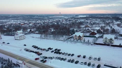 Forward drone flight over winter residential landscape Stockbeeldmateriaal 323576206