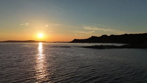 Forward Drone Flight Into Sunrise Over Tranquil Sardinian Beach Vídeo Stock 334946175