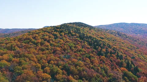 Forward drone flight toward Mount Sutton summit in autumn colors Stock Footage 318547422
