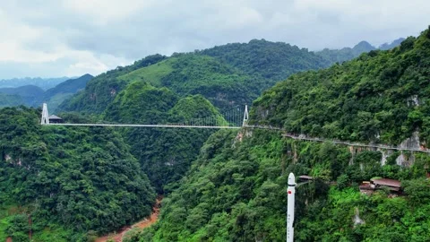 Forward drone flight towards glass bridge and mountain elevator 4K Stock Footage 337149395