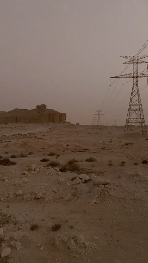 Forward drone movement along desert power lines Stock Footage 331952777