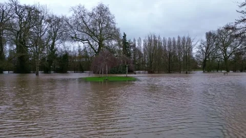 Forward drone movement over the flood watered Le Parc des Ondines public park Stockbeeldmateriaal 300541404