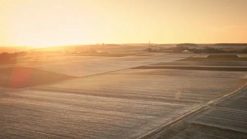 Forward Drone Over Frosty Patchwork Fields at Golden Hour 4K Video stock 328227817