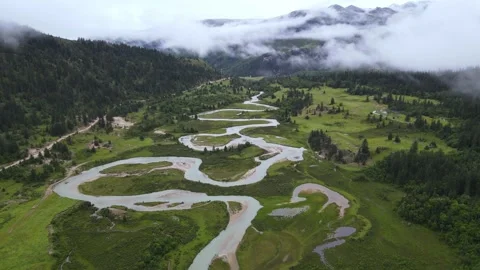 Forward Drone Over Meandering River in Alpine Plateau Meadow Sichuan China Stock Footage 330457440