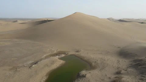 Forward Drone Over Sand Dunes and Desert Lake Ejina Inner Mongolia China Stock Footage 330455131