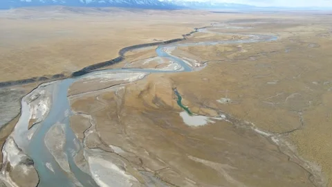 Forward Drone Over Winding River Qilian Plateau Northwest China Video stock 330457530