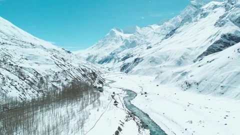 Forward Drone shot over snow clad mountains and extreme terrain of Indian Himala Stock Footage 255357529