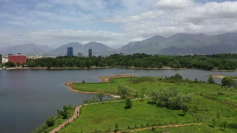 Forward drone shot over Tirana’s Artificial Lake Video stock 311055905