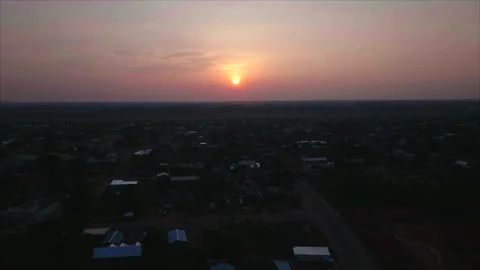 Forward drone at sunset in overall view, Ouesso, Congo Видео 331999956