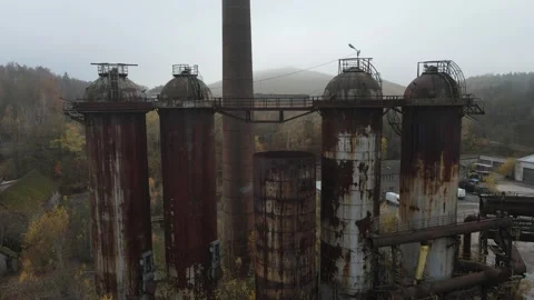 Forward drone under silo bridge at former steelworks Stock Footage 331898114