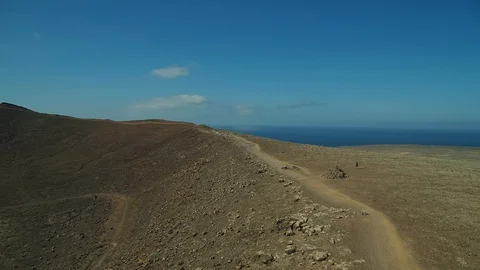 Forward flight dolly drone shot over volcano in Lanzarote Stock Footage 119377198