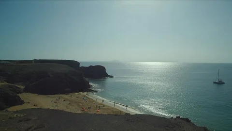 Forward flight dolly drone shot over beach in Lanzarote Stock Footage 119377241