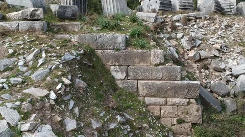 Forward flight from the ground and passing over of Athena Temple columns Stock Footage 104010194