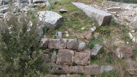 Forward flight from the ground to front side of Athena Temple columns Stock Footage 104010036