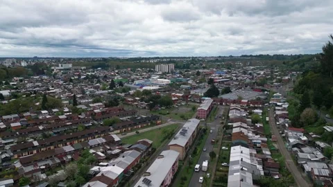 Forward flight over dense urban residential area with mixed housing blocks and Stock Footage 332609297