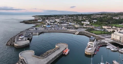 Forward flight over quiet marina basin, modern harbor breakwater wall and moo Stock Footage 340323236