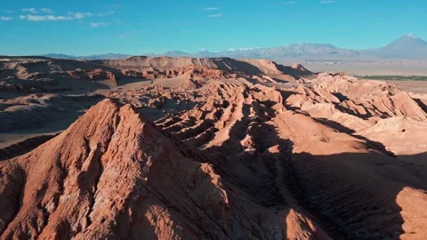 Forward flight over sharp salt ridges with desert plains, distant oasis Stockbeeldmateriaal 336266415