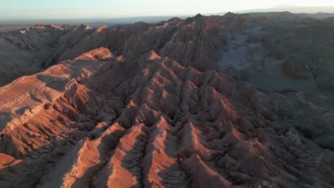 Forward flight over Valle de la Luna dramatic parallel eroded ridges glowing in Stock Footage 335216092