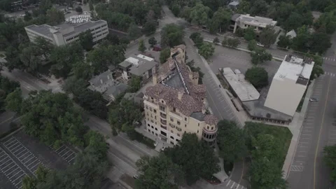 Forward flight pan down over apartment building in downtown fort collins Video stock 157735099