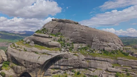 Forward Flight Toward a Massive Monolithic Rock Formation Stock Footage 341098894