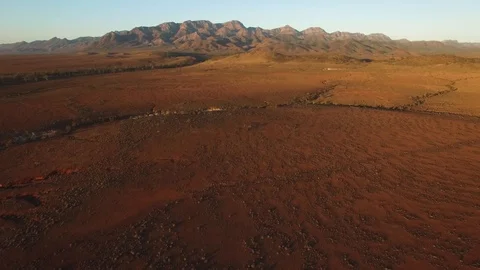 Forward flight towards Flinders Ranges mountains at sunset Stock Footage 93285302