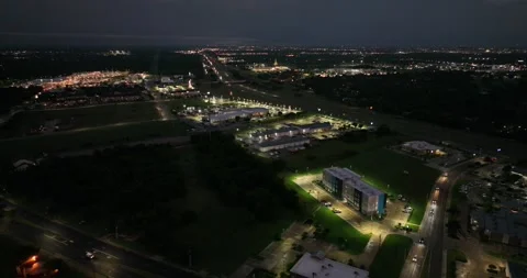Forward flight viewing business highways and traffic as night sets in Stock Footage 335669912