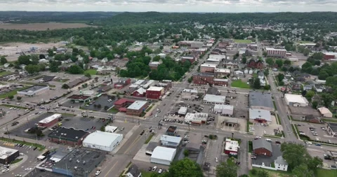 Forward flight viewing a rural town and moving traffic Video stock 335670946