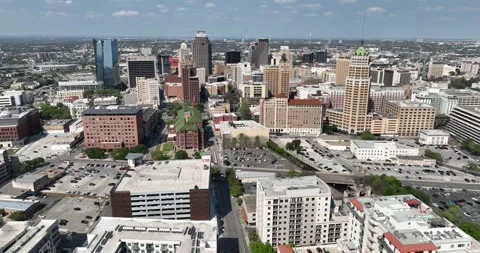 Forward flight viewing tall buildings in a busy city Stock Footage 236263223