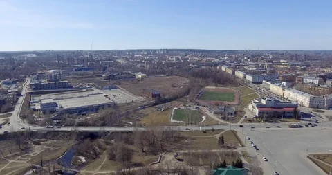 Forward flying and aerial view of city staduim and car traffic in city Stock Footage 106469114