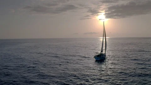 Forward to the Future.Flying drone view flight through across sail yacht to dawn Stock Footage 108097613