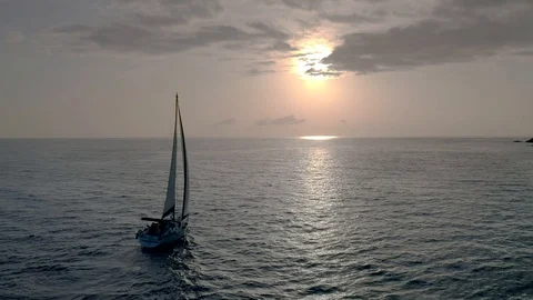 Forward to the Future.Flying drone view flight through across sail yacht to dawn Stock Footage 108099526