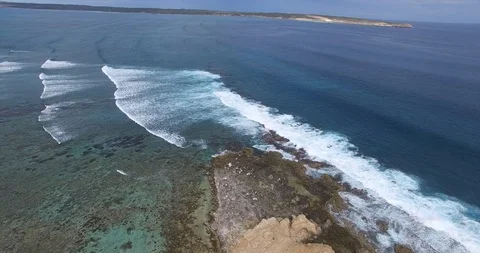 Forward horizontal flight of swells  breaking at Surf Point, Shark Bay Video stock 92843693