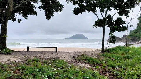 Forward Movement Towards Empty Beach Bench with Ocean View on Overcast Day Видео 347222207