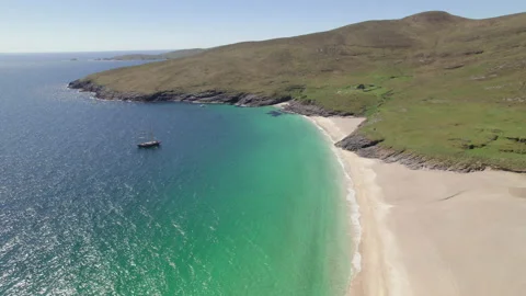 Forward moving aerial shot over Mingulay Bay, Outer Hebrides, Scotland Stock Footage 233105360