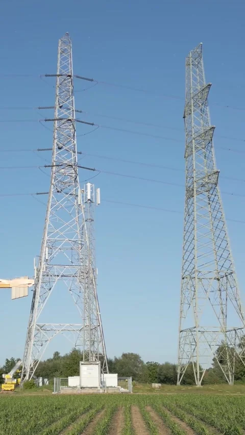 Forward-moving aerial shot process replacing electricity transmission lines, Stock Footage 283347233